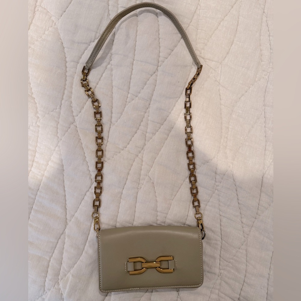 Zara Beige Crossbody with gold strap and front detail. Snap closure.